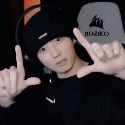 Man Wearing Black Hat And Headphones Making Peace Sign GIF