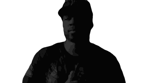 Man Wearing Black Hat And Shirt With A Sticker