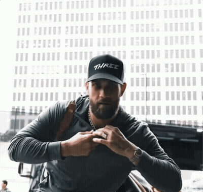 Man Wearing Black Hat Saying Three GIF