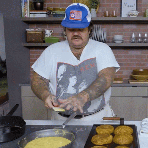 Man Wearing Blue Hat And REM Shirt GIF