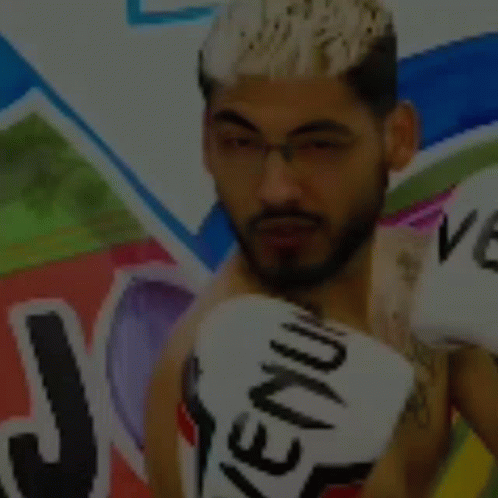 Man Wearing Boxing Gloves With Venum GIF