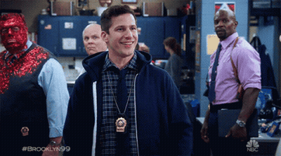 Man Wearing Brooklyn 99 Badge GIF