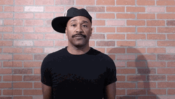 Man Wearing Cap Shrugs GIF