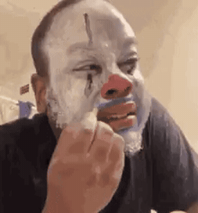 Man Wearing Clown Mask Shaving GIF