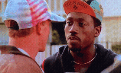 Man Wearing Colnago Hat Looks At Another GIF