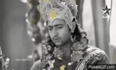 Man Wearing Crown And Garland GIF