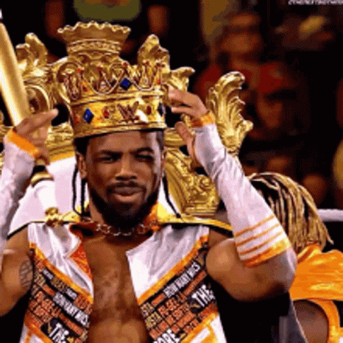 Man Wearing Crown And Gloves Holding Bat GIF