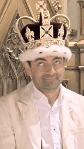 Man Wearing Crown And White Jacket GIF