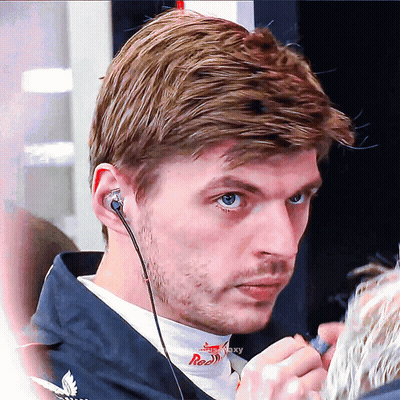 Man Wearing Earbuds With Red On Shirt GIF