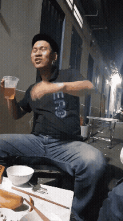 Man Wearing ECG Shirt Holding Beer