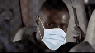 Man Wearing Face Mask Sitting On Plane GIF