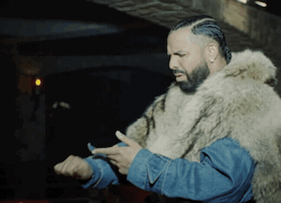 Man Wearing Fur Coat, Denim Jacket Checking Watch GIF