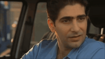 Man Wearing Glasses And Brown Jacket Smiling GIF