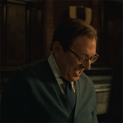 Man Wearing Glasses And Cardigan Laughing GIF