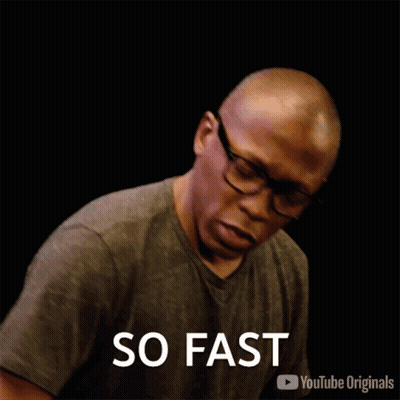 Man Wearing Glasses And Gray Shirt Saying Fast GIF