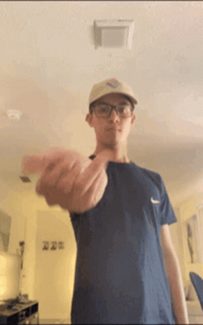 Man Wearing Glasses And Hat Flipping Off GIF