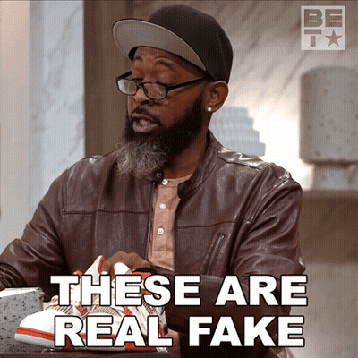 Man Wearing Glasses And Hat Holding Shoes GIF