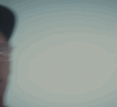 Man Wearing Glasses And Hat Looking At Camera GIF