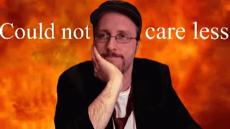 Man Wearing Glasses And Hat With Could Not Care Less Behind Him GIF
