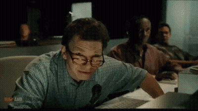 Man Wearing Glasses And Headphones At Desk GIF