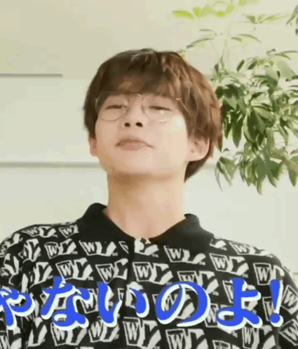 Man Wearing Glasses And Sweater With Letter W Making Funny Face GIF