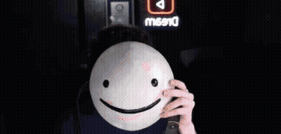 Man Wearing Glasses Holding Smiley Mask GIF