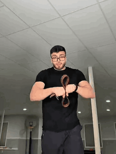 Man Wearing Glasses Holding Snake GIF