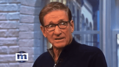 Man Wearing Glasses In Front Of Brick Wall GIF