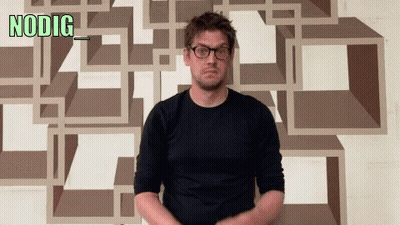 Man Wearing Glasses In Front Of NODIG Wall GIF