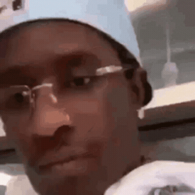 Man Wearing Glasses Looking At Camera GIF