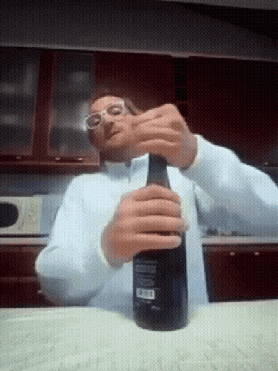 Man Wearing Glasses Opening Bottle GIF
