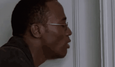 Man Wearing Glasses Peeking Out Of Door GIF