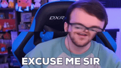 Man Wearing Glasses Sitting In Gaming Chair GIF