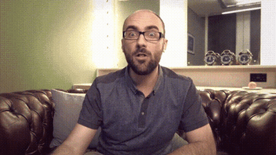 Man Wearing Glasses Sitting On Couch GIF