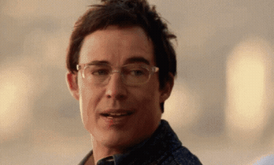 Man Wearing Glasses Smiling At Camera GIF