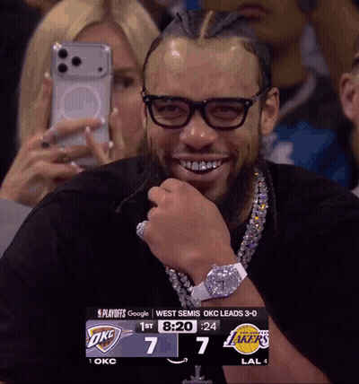 Man Wearing Glasses Smiling At Scoreboard GIF