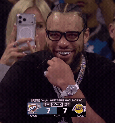 Man Wearing Glasses Smiling At Scoreboard GIF