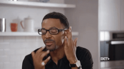 Man Wearing Glasses Touching Face GIF
