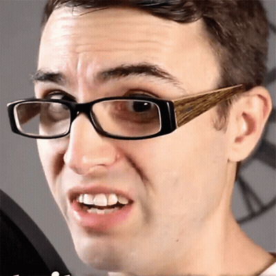 Man Wearing Glasses With Wooden Frames GIF