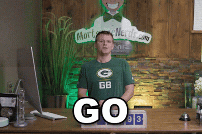 Man Wearing Green Bay Packers Shirt With Mort Nerds.com Sign GIF