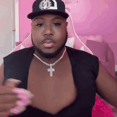Man Wearing Hat And Cross Necklace GIF