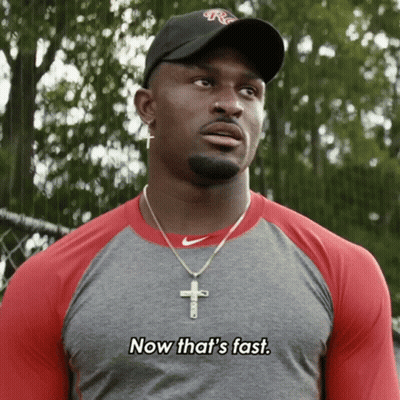 Man Wearing Hat And Cross Necklace Says Now That's Fast GIF