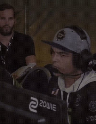 Man Wearing Hat And Headphones In Front Of Zowie Monitor GIF