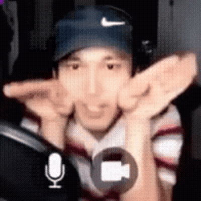 Man Wearing Hat And Headphones Singing GIF
