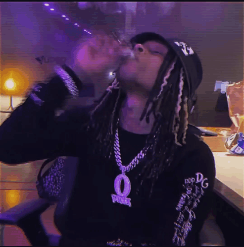 Man Wearing Hat And Necklace With O Smoking Cigarette GIF