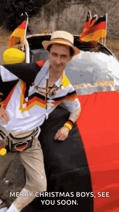Man Wearing Hat In Front Of Car With German Flags GIF