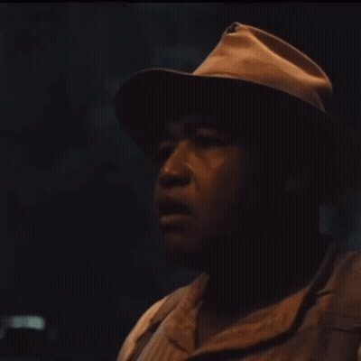 Man Wearing Hat Looking Sideways GIF