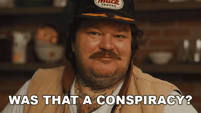 Man Wearing Hat That Says Muck Trucks GIF