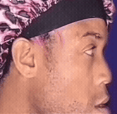 Man Wearing Headband And Leopard Print Hat GIF
