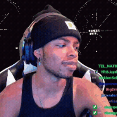 Man Wearing Headphones And Beanie At Computer GIF